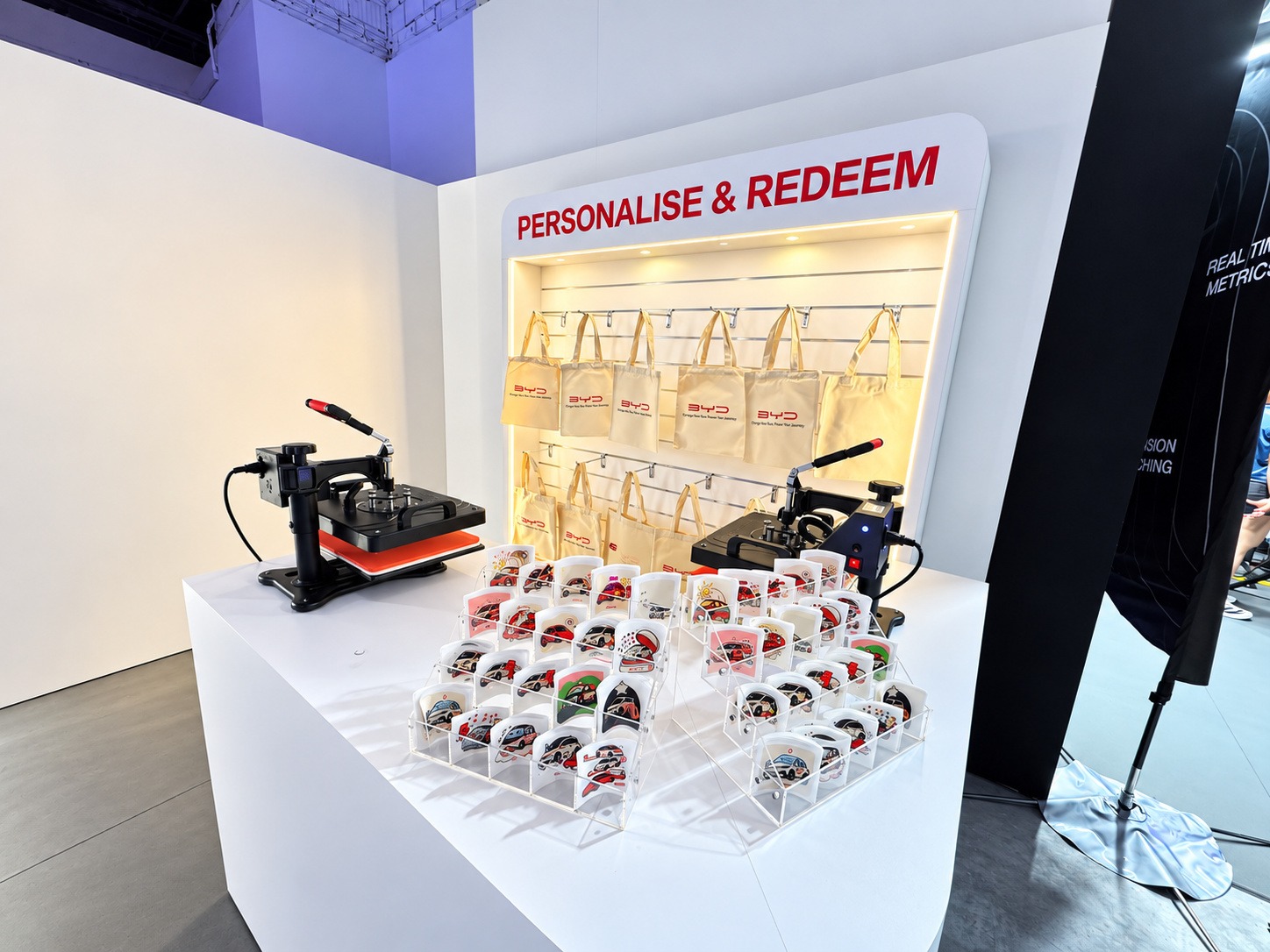 Custom tote bag printing station with transfer designs and heat presses