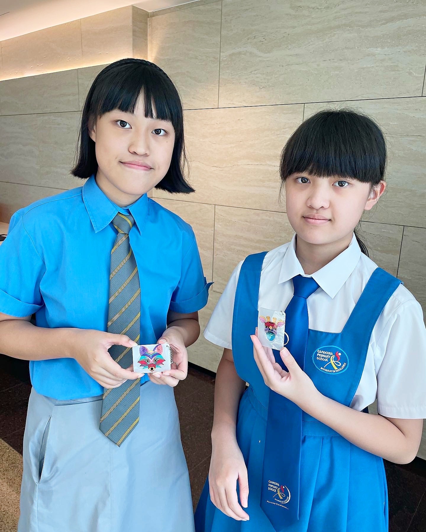 Students showing shrink art keychains